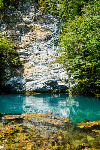 Emerald small lake among the rocks