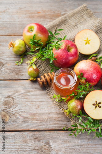 Rosh Hashana, jewish new year holiday concept, honey, apple, pomegranate