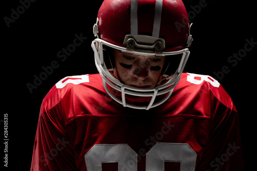 American football player standing with rugby helmat © wavebreak3