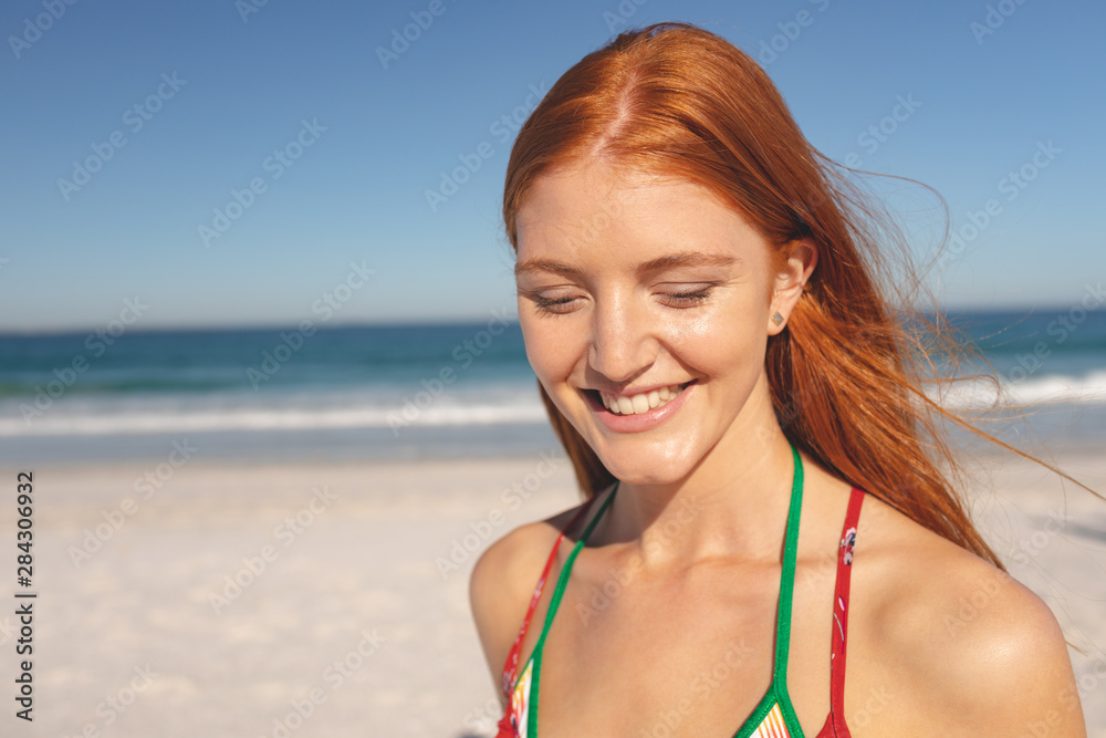 Happy woman standing on the beach Happy woman standing on the beach