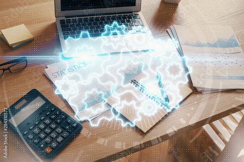 Double exposure of business theme icons and work space with computer background. Concept of success.