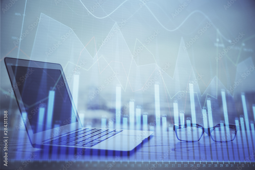Forex Chart hologram on table with computer background. Multi exposure. Concept of financial markets. Forex Chart hologram on table with computer background. Multi exposure. Concept of financial markets.