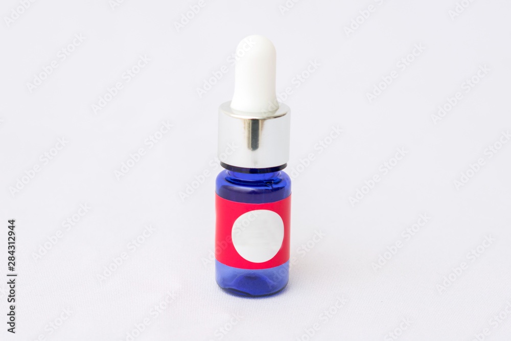 Jar of serum, vessel with the pipette, background, copy space Jar of serum, vessel with the pipette, background, copy space
