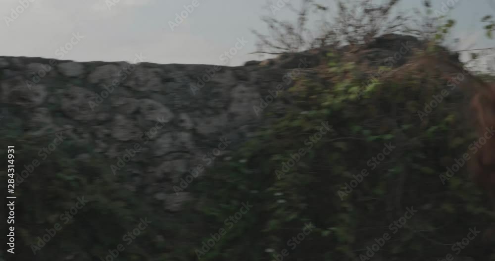 Young attractive woman jogging on sea shore cliff at sunrise Young attractive woman jogging on sea shore cliff at sunrise