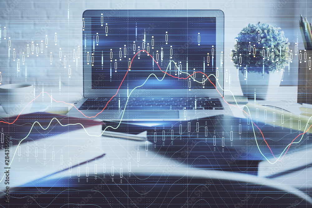 Financial chart drawing and table with computer on background. Multi exposure. Concept of international markets. Financial chart drawing and table with computer on background. Multi exposure. Concept of international markets.