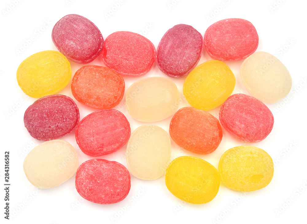 Multicolored sugar sweet sucking candy isolated on white background. Medical herbal lozenges. Flat lay, top view Multicolored sugar sweet sucking candy isolated on white background. Medical herbal lozenges. Flat lay, top view