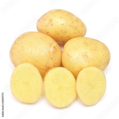 Young potato and slice isolated on white background. Harvest new. Flat lay, top view