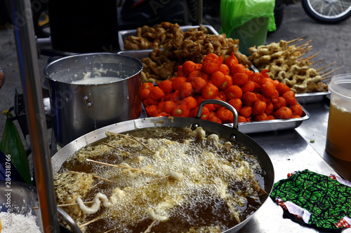 Assorted street food at a street food cart photo