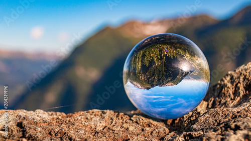 Crystal ball alpine landscape shot at the famous Grossglockner High Alpine Road, Salzburg, Austria © Martin Erdniss