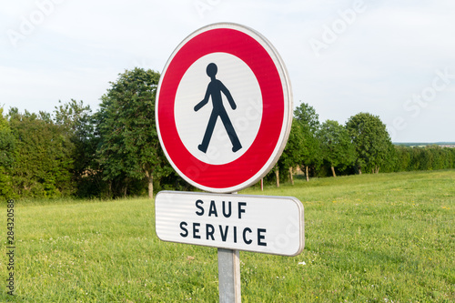 Fototapeta Naklejka Na Ścianę i Meble -  No crossing sign except for staff in France.