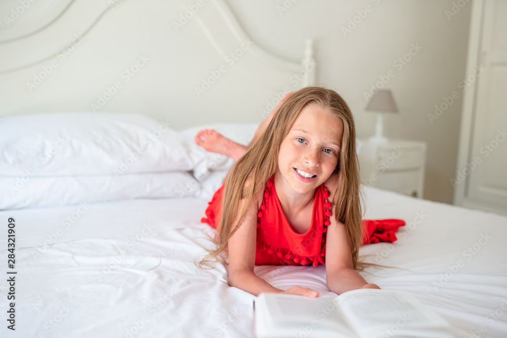 Cute little girl doing homework on laptop Cute little girl doing homework on laptop