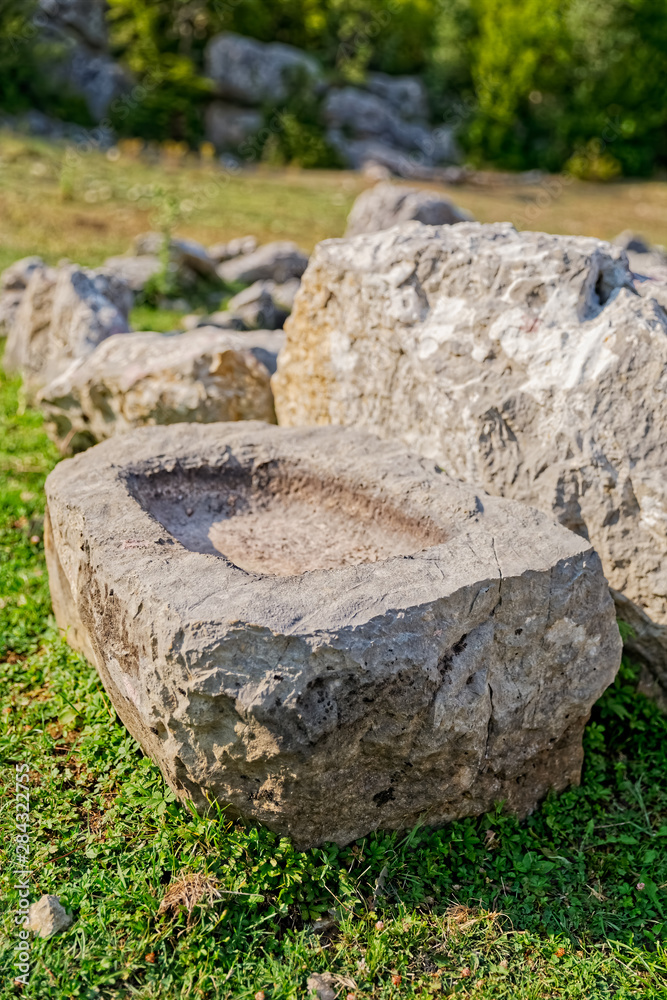 Fototapeta premium Stone water bowl at Roman wells in Rajcice