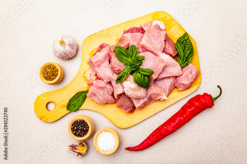 Raw pork neck, cut into pieces with fresh vegetables and dry spice