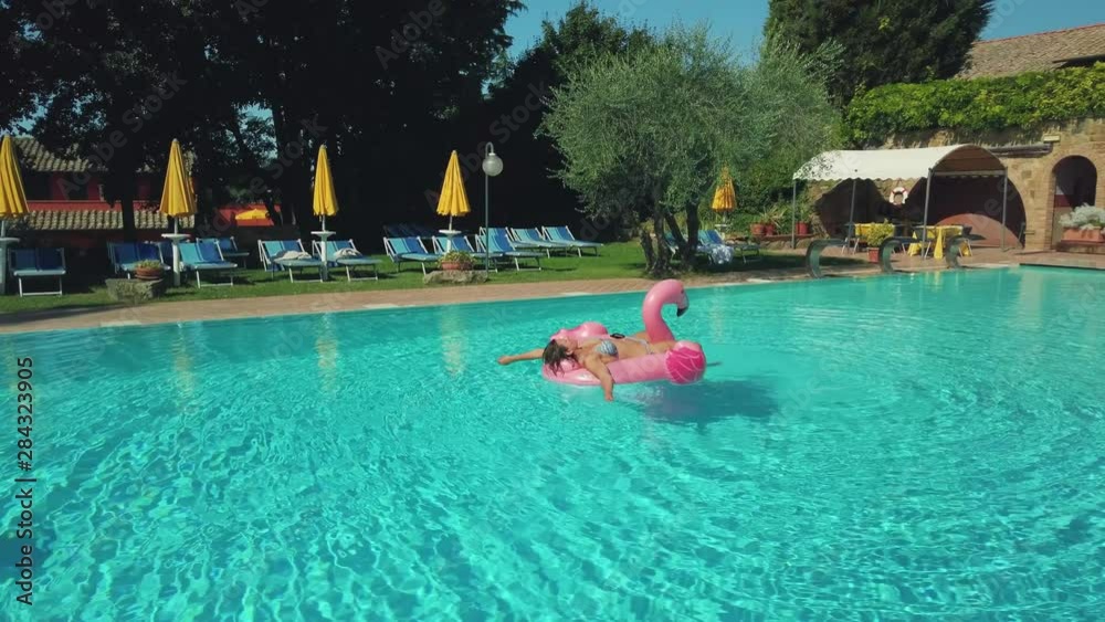 Young woman relaxing in pool