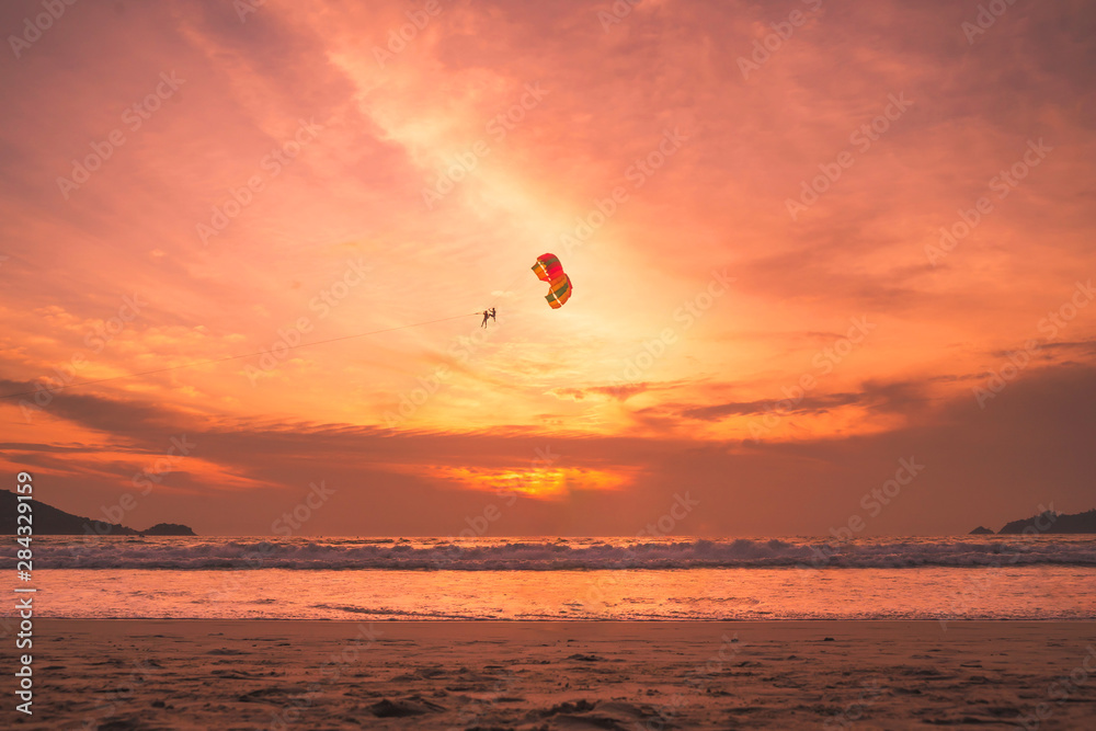 Sunset lovers, bright orange sky, on the beach Famous Phuket Patong Thailand Sunset lovers, bright orange sky, on the beach Famous Phuket Patong Thailand