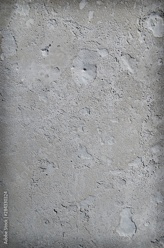 Urban concrete wall background with grooves and bubbles. Cement gray wall. Urban and industrialization art concept. Texture like concrete  stone  cement  plaster.. Poster mockup.   loseup studio shot.