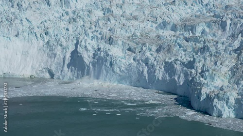 Ice Sheet Glacier Calving - Giant Break Off at Greenlandic Glacier photo