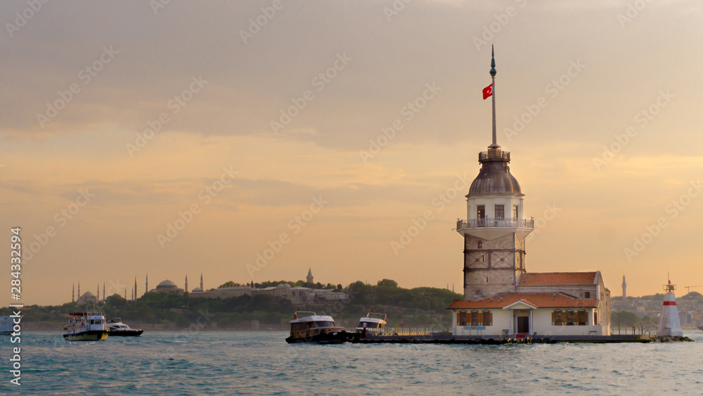 Sunset at maiden's tower, istanbul, turkey. Marmara sea and bosphorus with touristic light house.