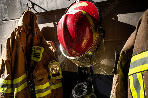 Red firefighter helmet hanging in the fire station