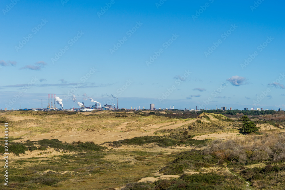industry behind the dunes