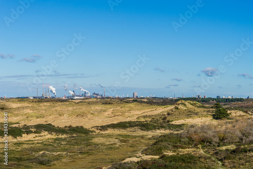 industry behind the dunes