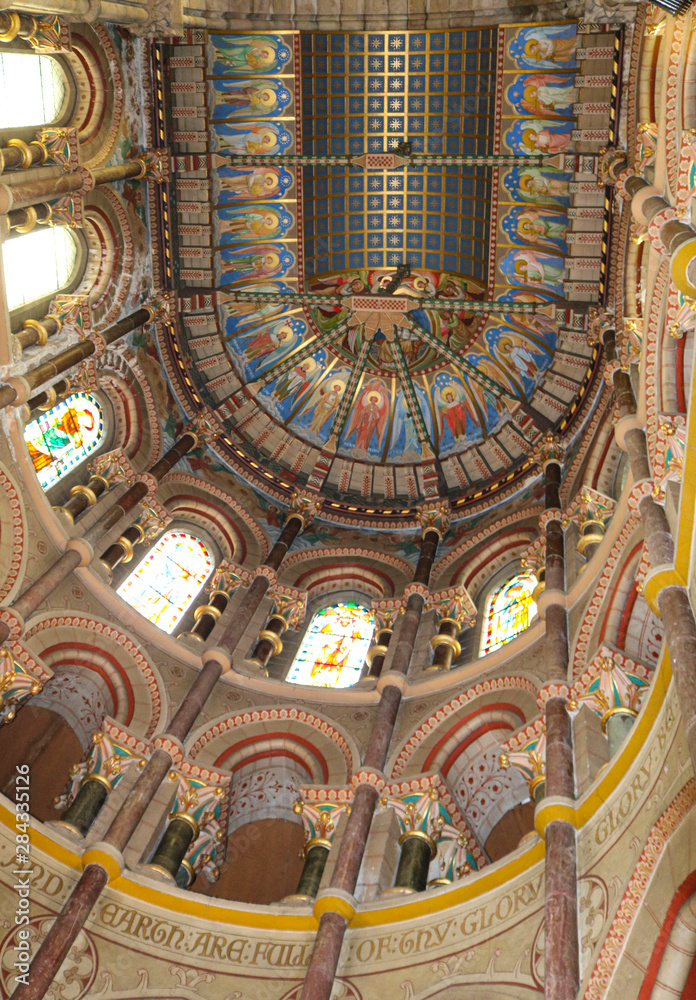 Saint Fin Barre's Cathedral is cathedral in the city of Cork, Ireland. Interior of cathedral. Apse and sanctuary ceiling.