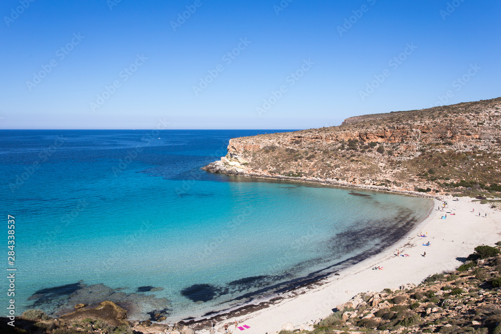 Lampedusa Island Sicily - Rabbit Beach with no people and Rabbit Island Lampedusa “Spiaggia dei Conigli” with turquoise water white sand at paradise beach.