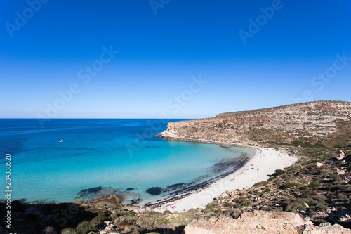Lampedusa Island Sicily - Rabbit Beach with no people and Rabbit Island Lampedusa “Spiaggia dei Conigli” with turquoise water white sand at paradise beach. © Giacomo