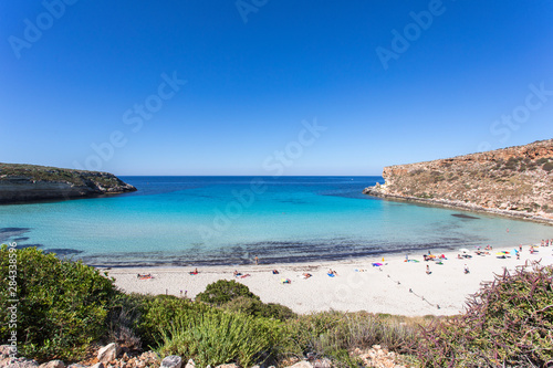 Lampedusa Island Sicily - Rabbit Beach with no people and Rabbit Island Lampedusa    Spiaggia dei Conigli    with turquoise water white sand at paradise beach.