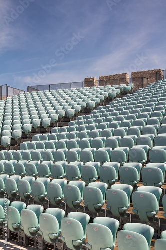 Blue empty seats in the auditorium outdoors