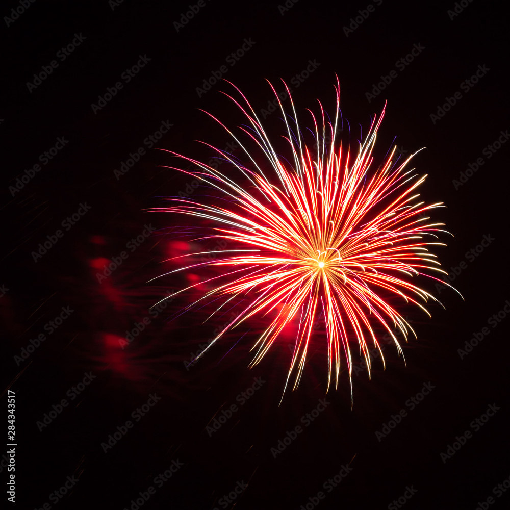 Purple, red, green, and gold fireworks explode during an Independence Day celebration in the United States. Purple, red, green, and gold fireworks explode during an Independence Day celebration in the United States.