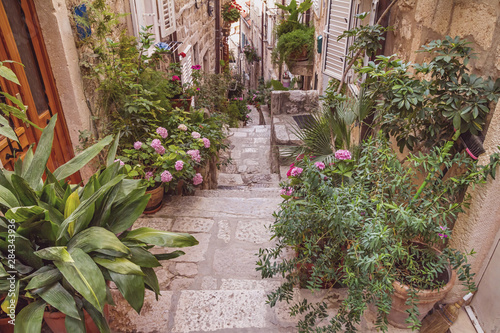 Mediterranean summer cityscape - view of a medieval street with stairs in the Old Town of Dubrovnik on the Adriatic Sea coast of Croatia