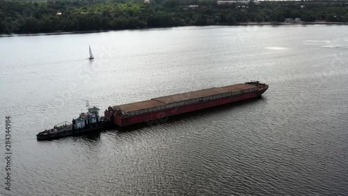 Arial of waterways leading up to Dnipro on river Dnepr focusing on a pram and tug boat photo