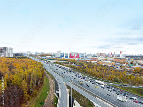 Drone flies over the road urban junction. Highway in Moscow. Bird's eye view.
