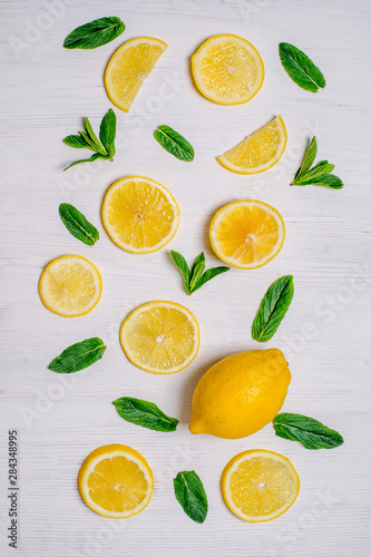 background with lemon slices and mint leaves beautifully laid out