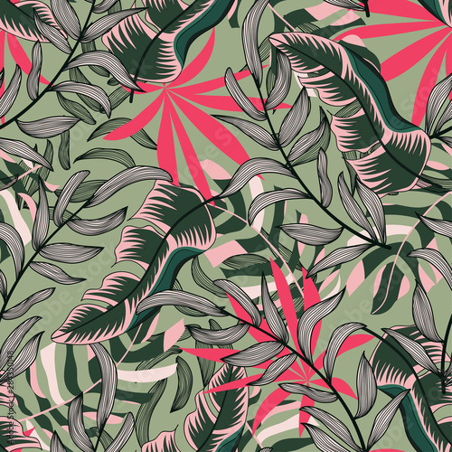 Original abstract seamless pattern with colorful tropical leaves and plants on green background. Vector design. Jungle print. Floral background. Printing and textiles. Exotic tropics. Summer.