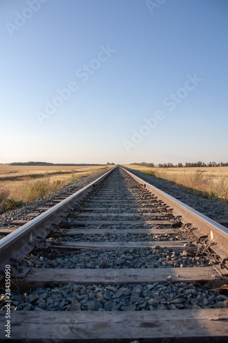 railway tracks go into the horizon