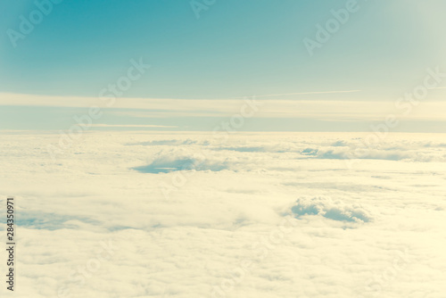 Filtered image unreal and dramatic Altocumulus cloud formation at sunrise from airplane