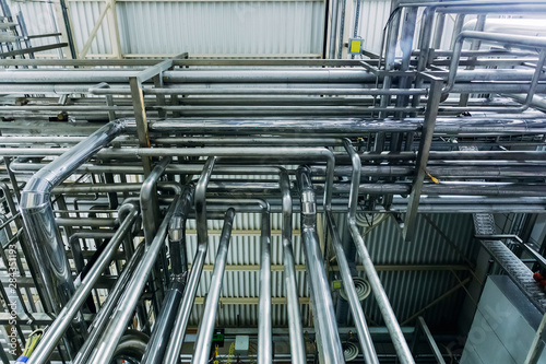Steel pipes of industrial machinery equipment at chemical or food factory
