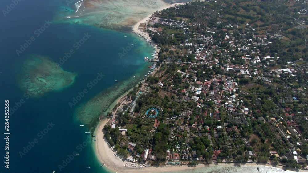 Aerial view of the Gili Islands off the coast of Lombok, Indonesia. The Gilis are a popular holiday destination for tourists visiting Bali and Lombok. Aerial view of the Gili Islands off the coast of Lombok, Indonesia. The Gilis are a popular holiday destination for tourists visiting Bali and Lombok.