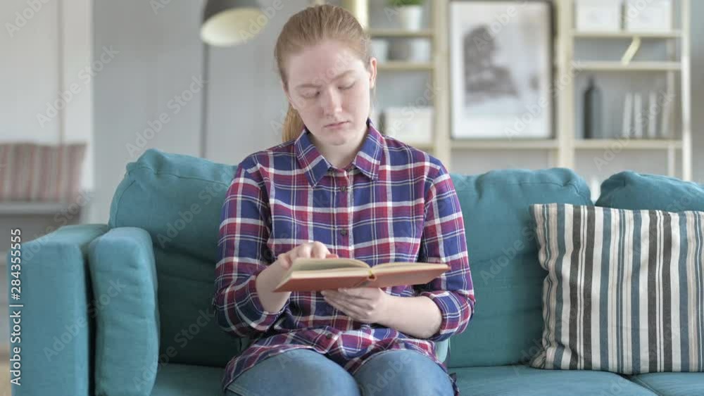 Young Woman Sitting on Couch And reading Young Woman Sitting on Couch And reading