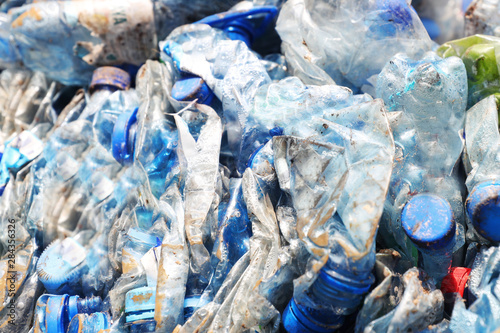 Compressed bales of plastic PET bottles ready for recycling