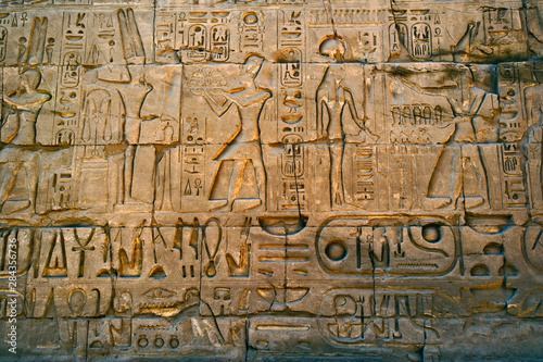 Ancient hieroglyphs on wall, Temple of Karnak, located at modern day Luxor or ancient Thebes, Egypt