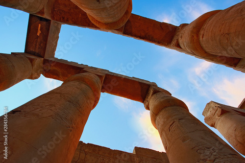 Skyward view of massive columns at sunset, Luxor Temple located at modern day Luxor or ancient Thebes