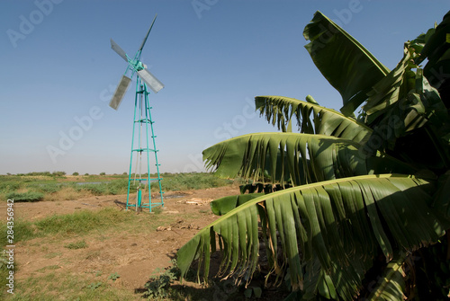 Ethiopia: Lower Omo River Basin, Omo Delta at low water season, Yelokoriyay, a Dassenech village, windmill used for irrigation photo