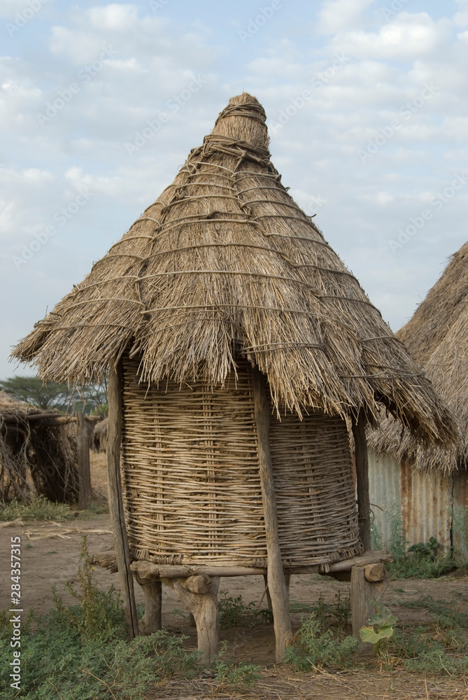 Ethiopia: Lower Omo River Basin, Karo village of Duss, thatched home on stilts for chickens