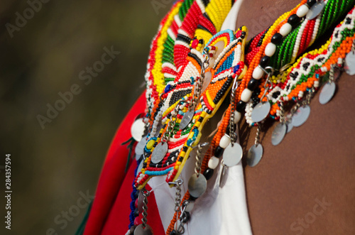 Kenya, Laikipia, Il Ngwesi, Masai man wearing traditional clothes and adorned with elaborate beadwork jewelry photo