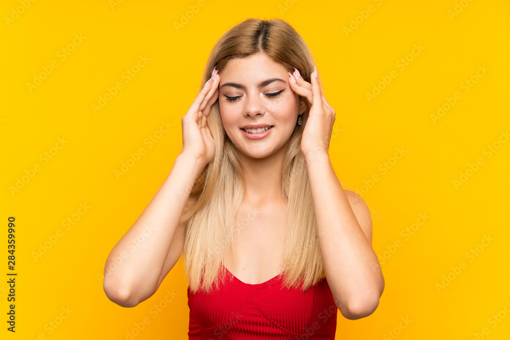 Teenager girl over isolated yellow background unhappy and frustrated with something. Negative facial expression Teenager girl over isolated yellow background unhappy and frustrated with something. Negative facial expression