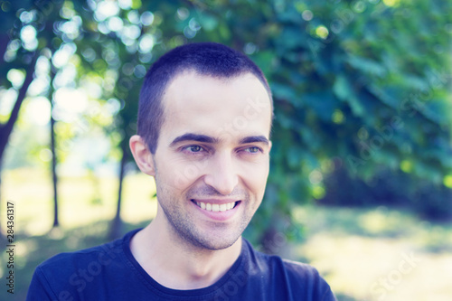 Attractive man smiling, portrait, close up, toned