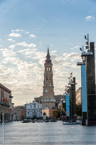 View of the tower of the Cathedral of La Seo, Zaragoza (Spain), and the Plaza de El Pilar, at dawn.